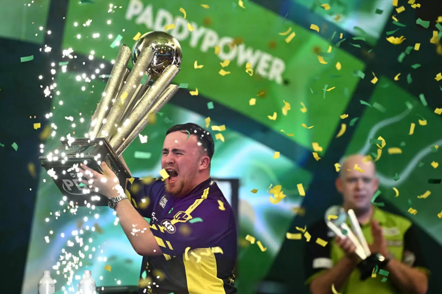 Although we imagine the Sid Waddell trophy is better than any birthday party blowout (BEN STANSALL/AFP via Getty Images)