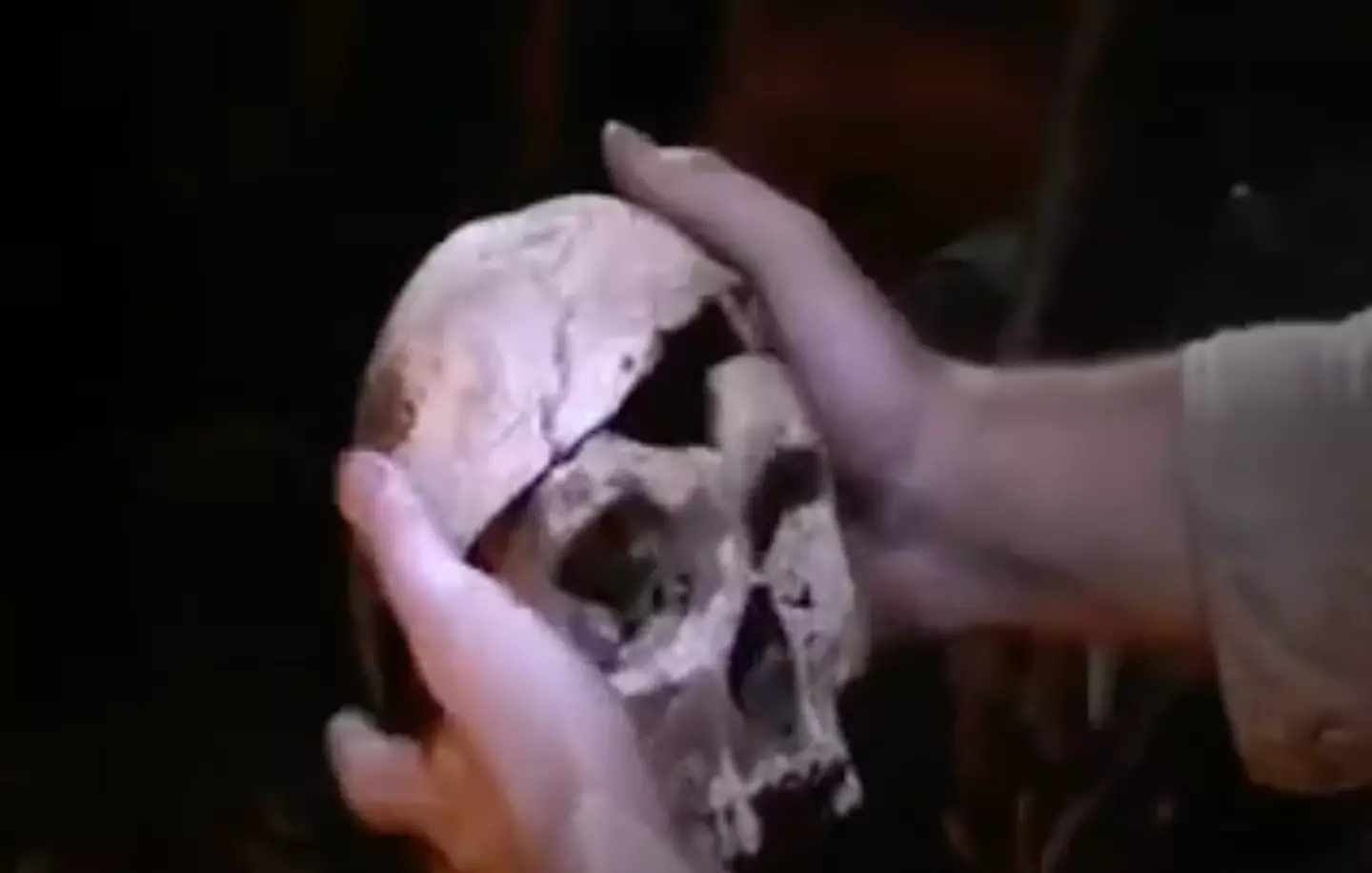 Filmmaker who travelled to 'cannibal tribe' showcases moment man admits to 'eating his friend' 2 The tribesman kept the skull of his victim (Youtube/Journeyman Pictures)