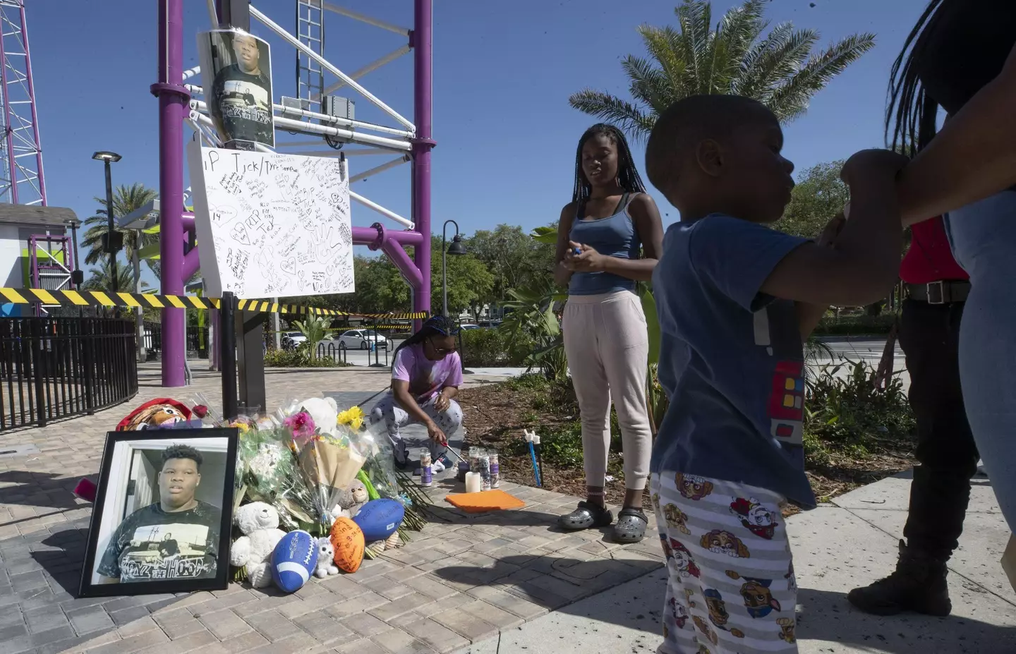 People light candles at a memorial sight for Tyre Sampson.