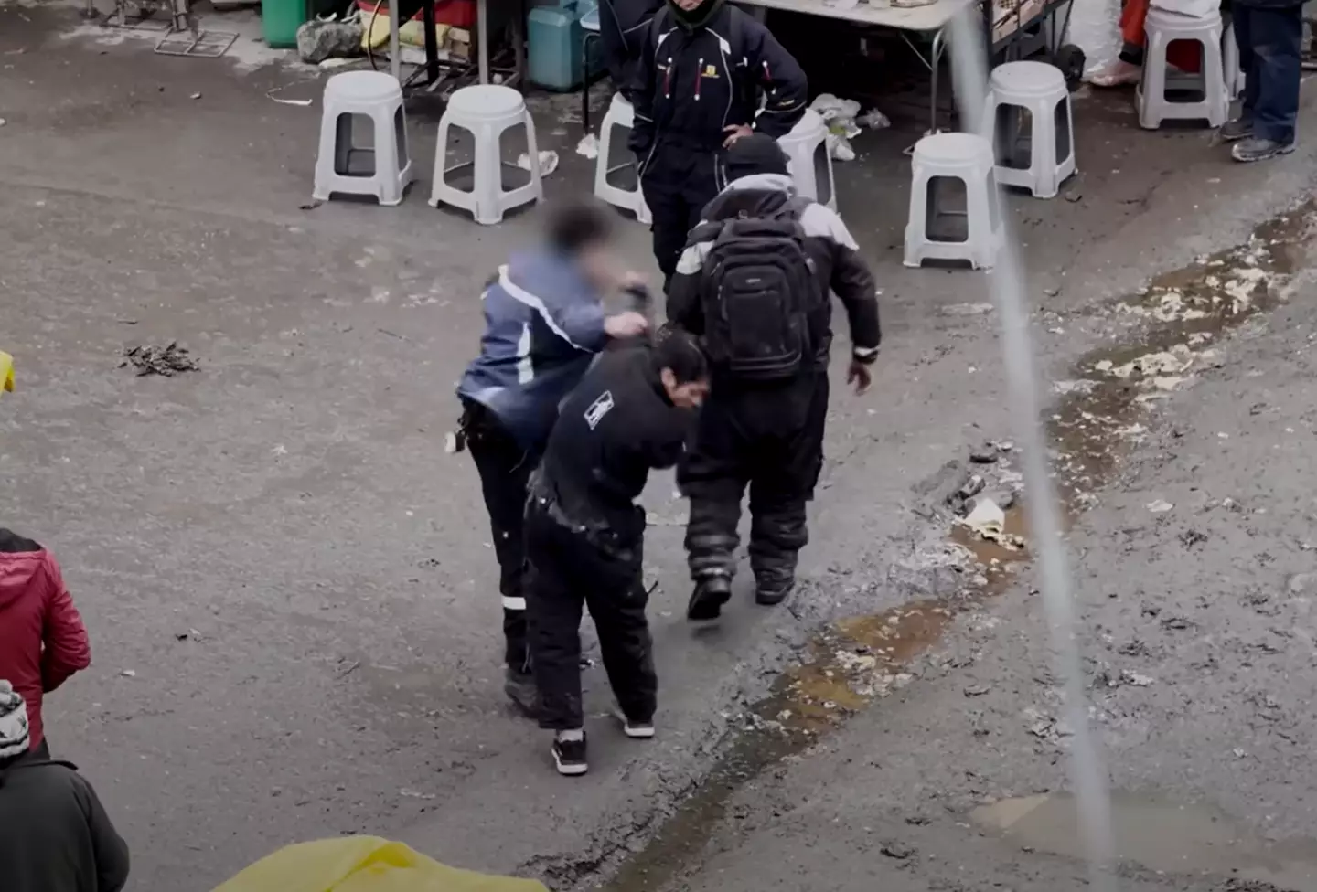 The filmmakers saw numerous fights going on outside their window. (YouTube / Yes Theory)