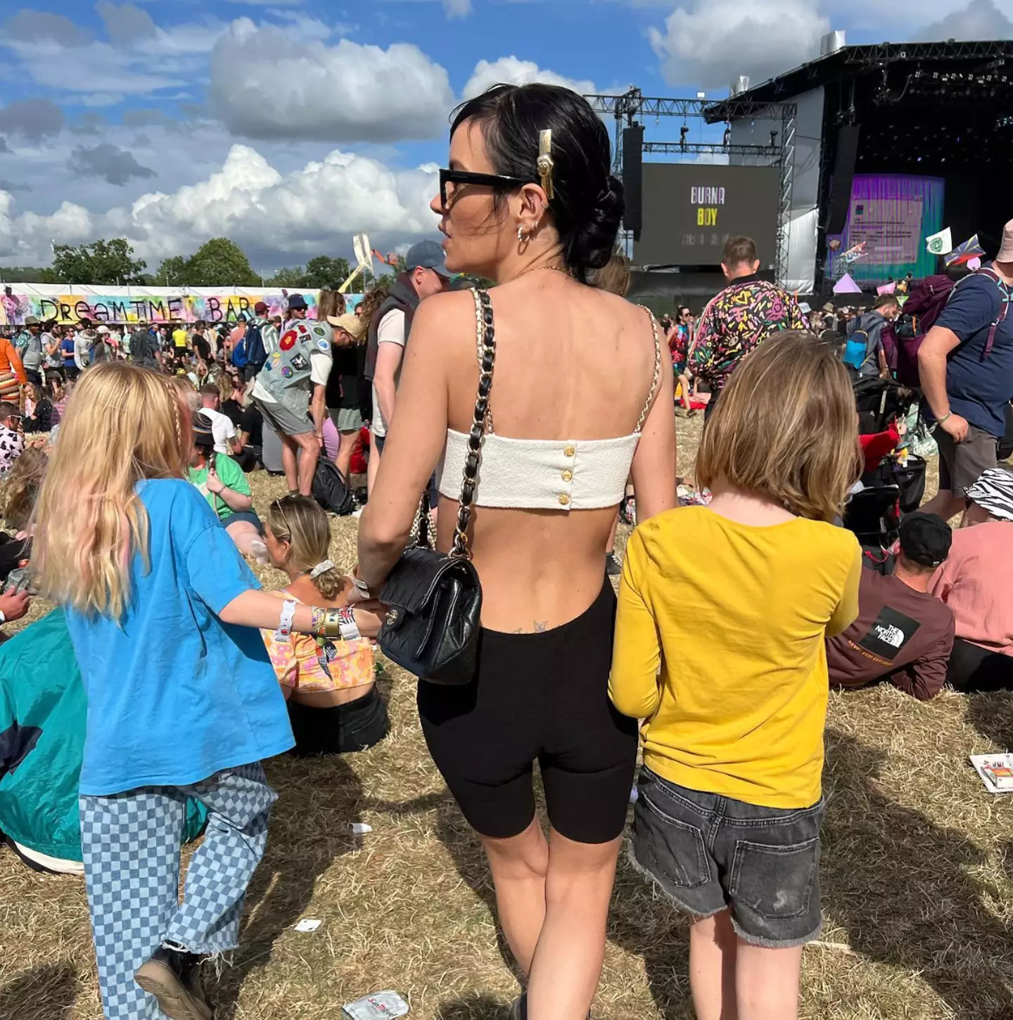 Lily Allen at Glastonbury Festival with her two daughters.