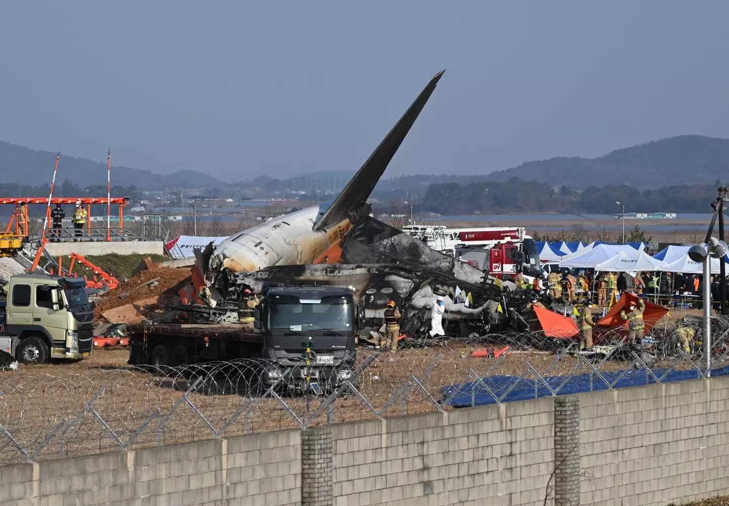 The plane skidded across the runway and hit a wall (JUNG YEON-JE/AFP via Getty Images)