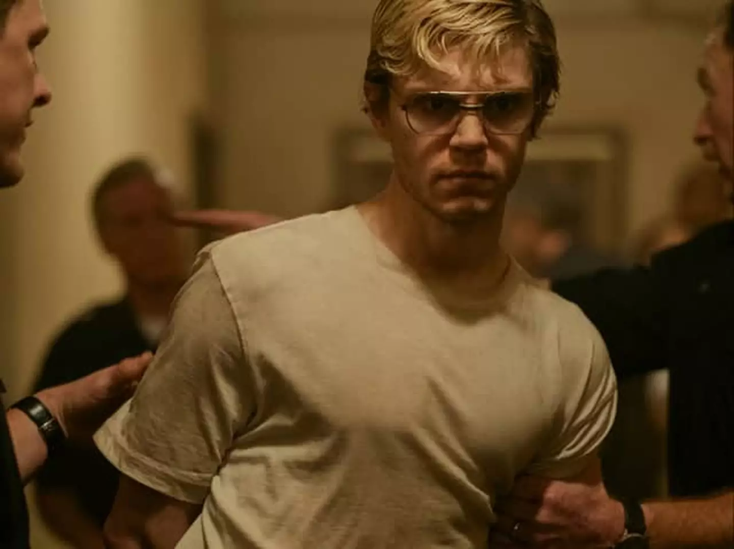 Evan Peters as Jeffrey Dahmer.