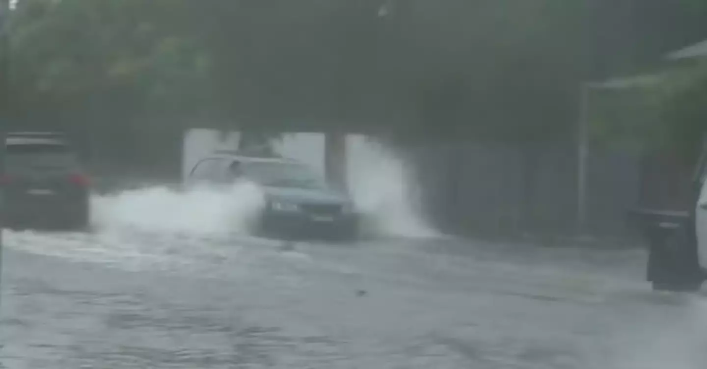 The reporter slammed the motorist's 'stupid behaviour' amid the stormy weather (7 News)