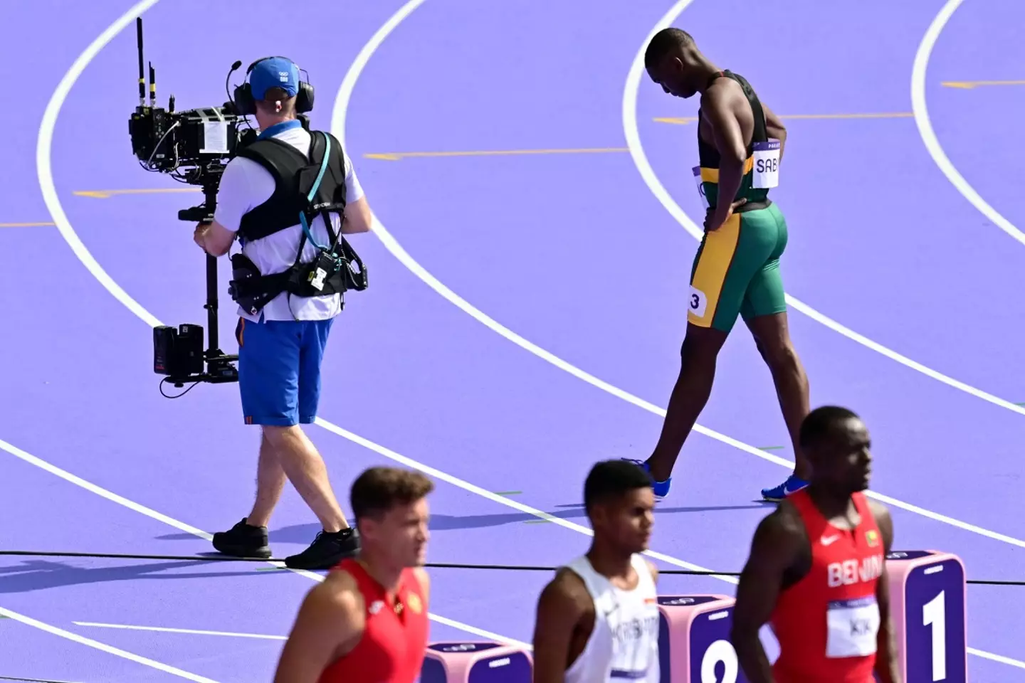 The young sprinter was devastated. (ANNE-CHRISTINE POUJOULAT/AFP via Getty Images)
