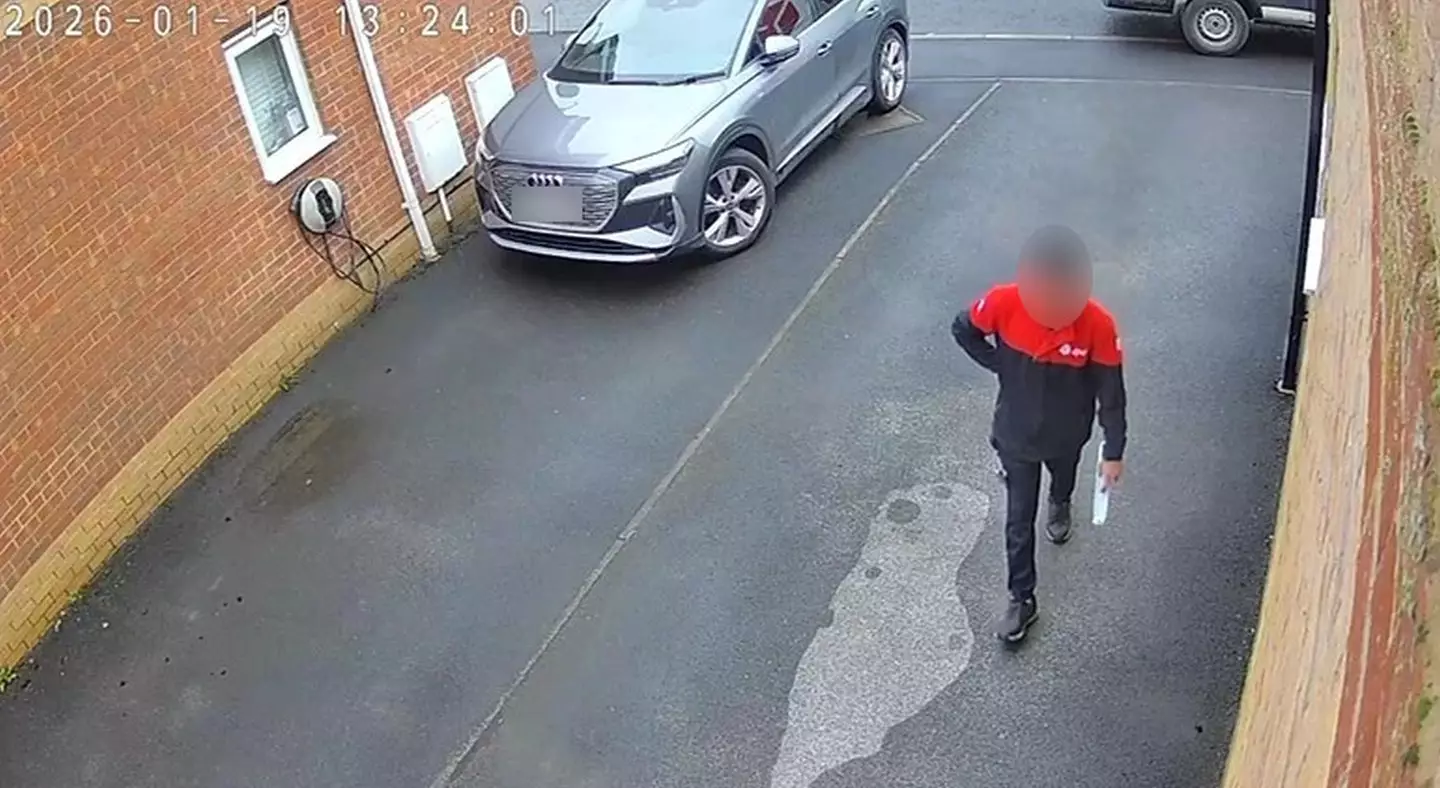 The delivery driver was seen walking up to the door with the parcel (Kennedy News and Media)