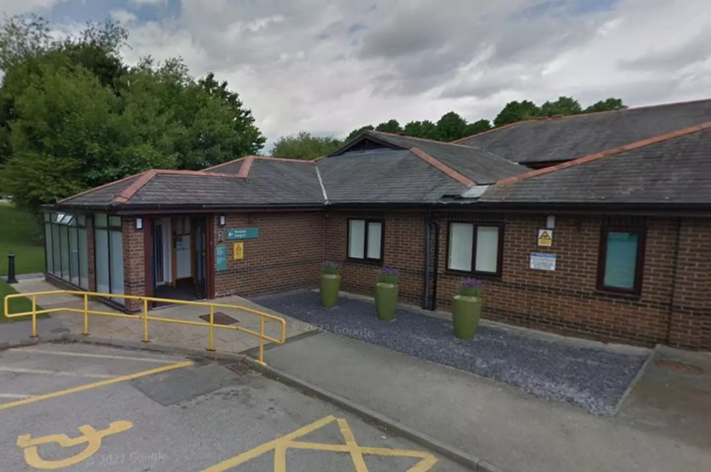 The man sadly died in the car park of a Spire Hospital in Wrexham.