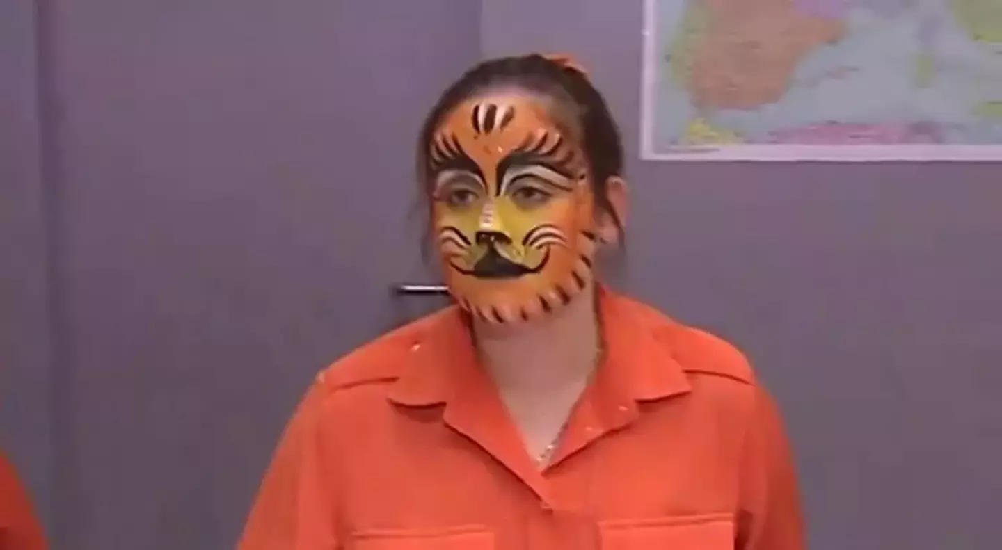 The airline employee was hilariously sporting animal-themed face paint. (ITV)