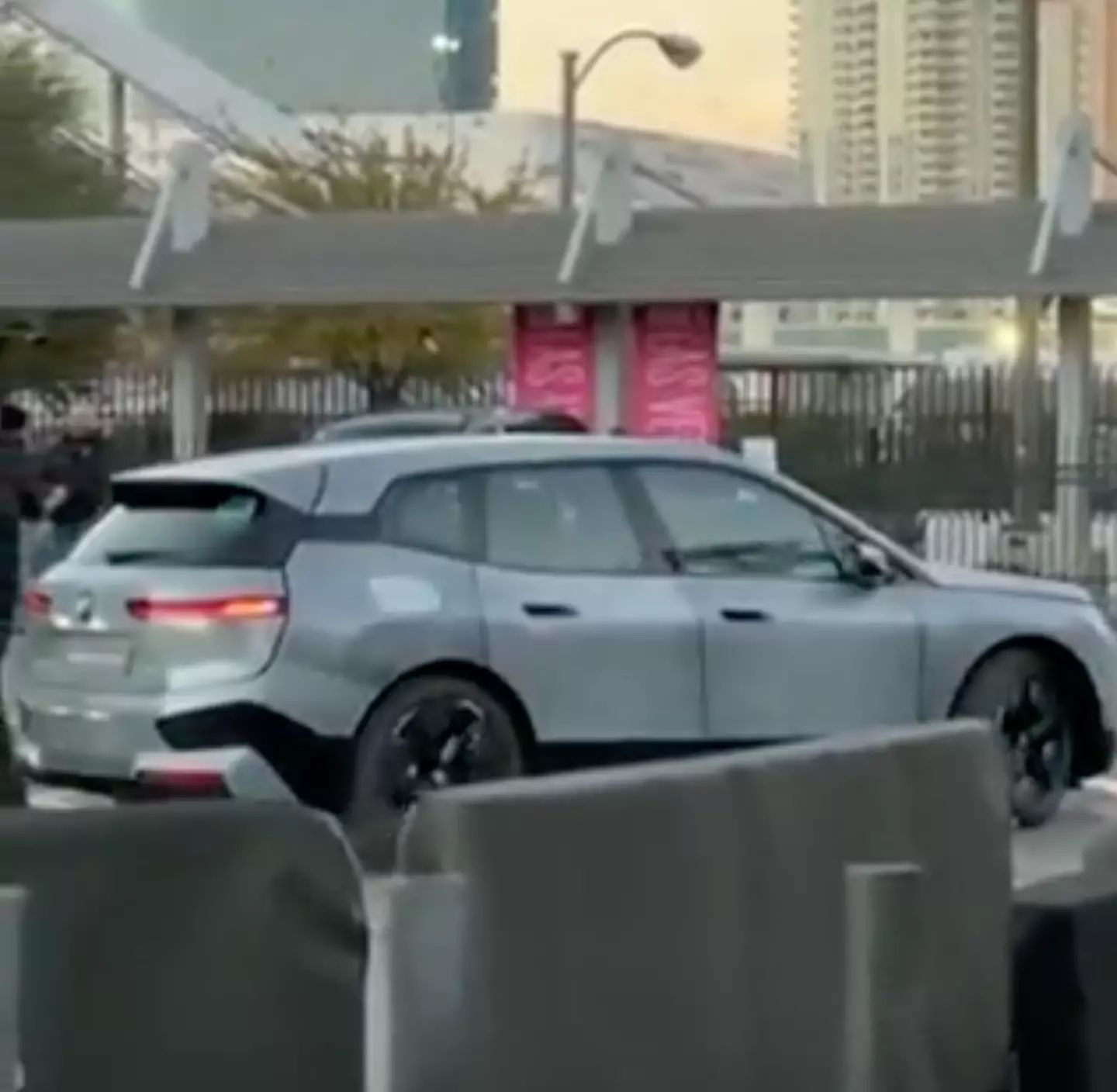 The BMW iX Flow changing colour while reverse parking.