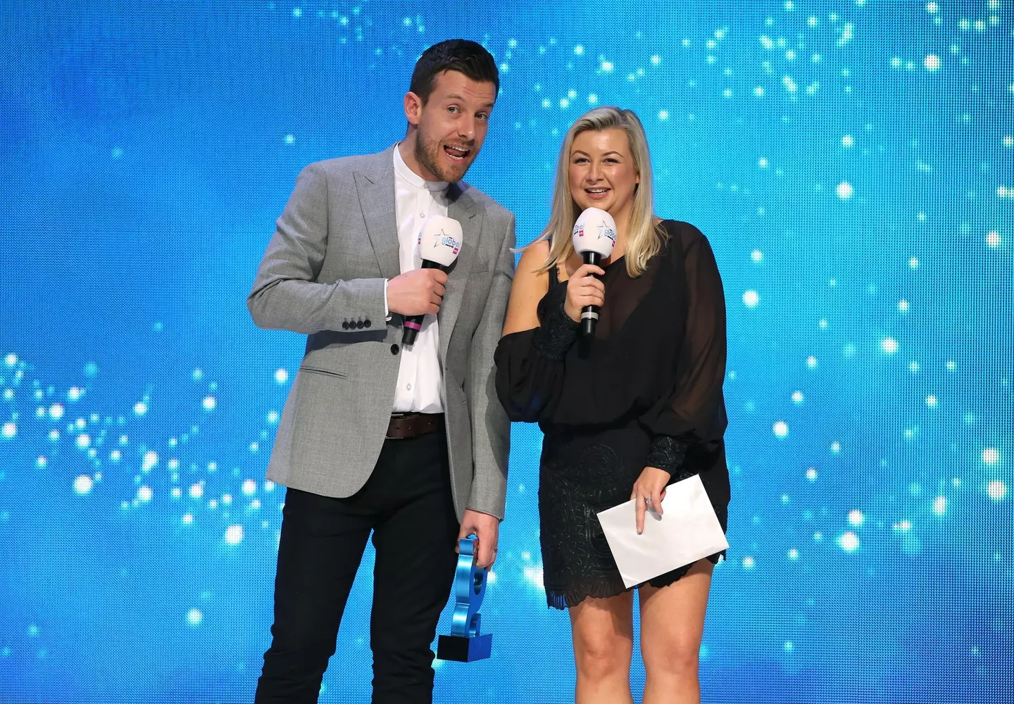 Chris Ramsey and Rosie Ramsey present the award for Best Song of 2019 on stage at the Global Awards 2020,
