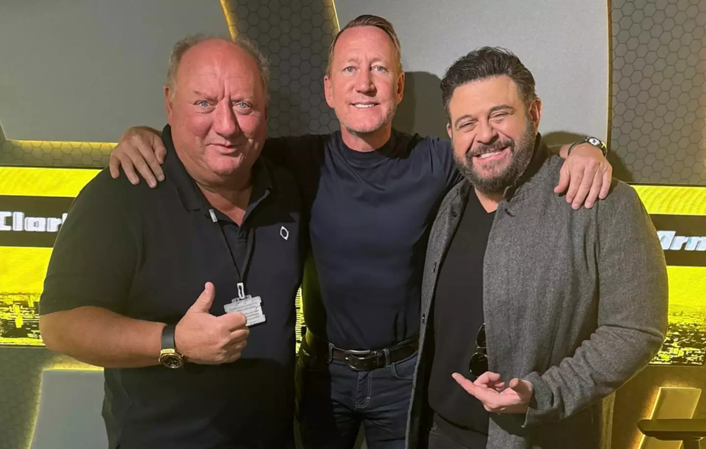 Richman pictured with former footballers Alan Brazil and Ray Parlour.