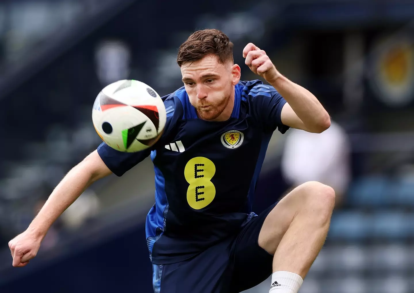 While he's preparing to kick a ball around against Germany, you can have a pint. (Ian MacNicol/Getty Images)