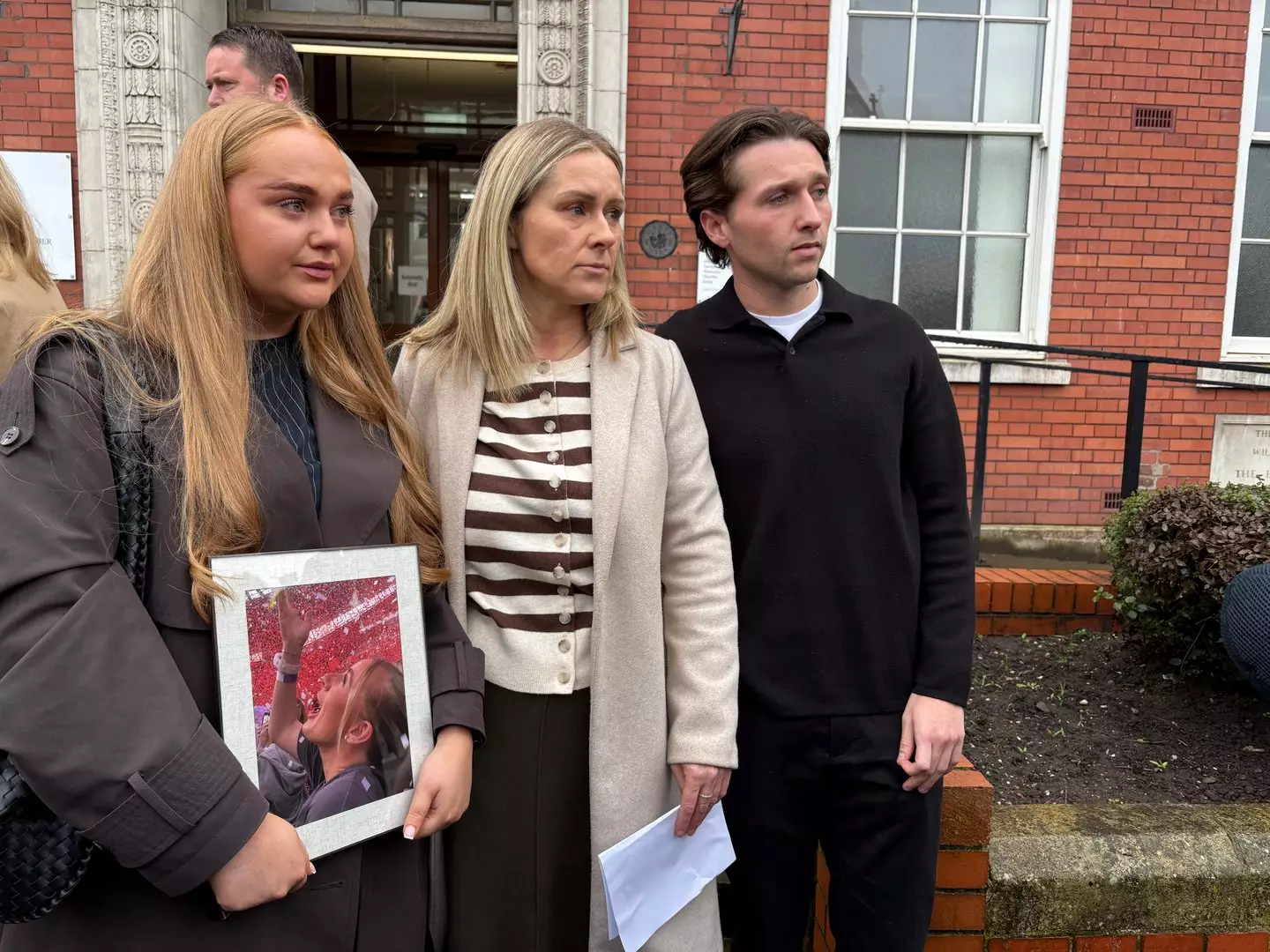 Jane Coates (centre), standing outside Cheshire Coroner's Court accompanied by her daughter's friend Ella Gowing (left) and boyfriend Sam Littler (right) (Eleanor Barlow/PA Wire)