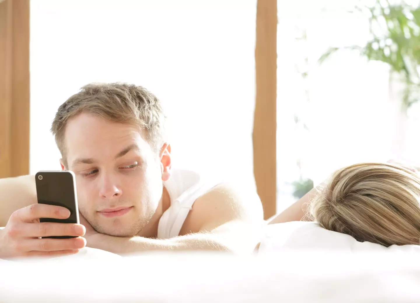 Are they getting up super early to text? Another Red Flag. Peter Cade / Getty Images