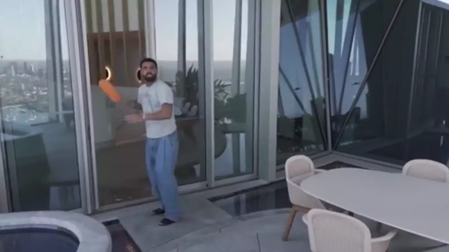 'Truth' behind viral drone footage catching Drake out in penthouse as eagle-eyed viewers notice background detail