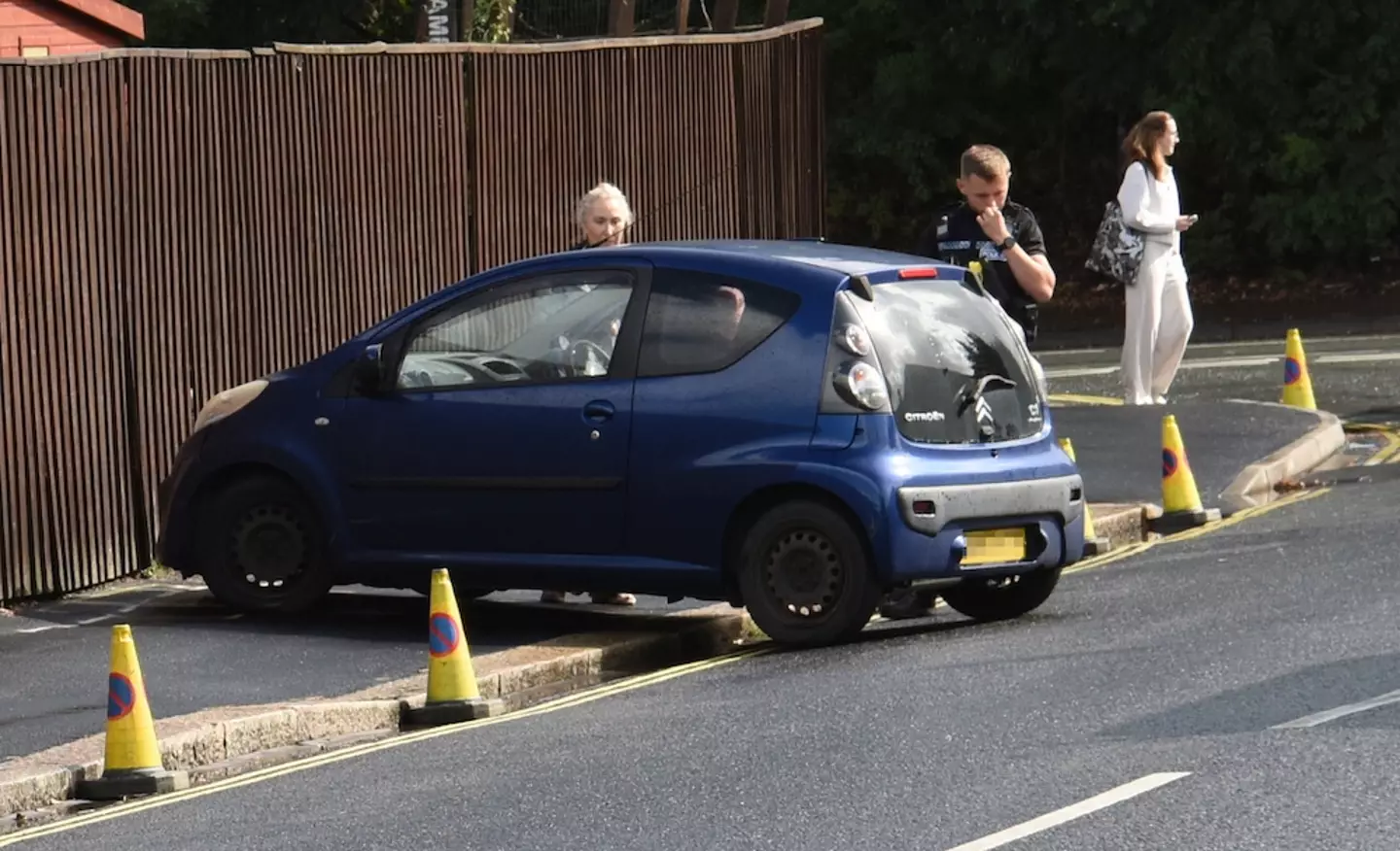 The mum parked her car on the pavement where the workers were set to start digging.
