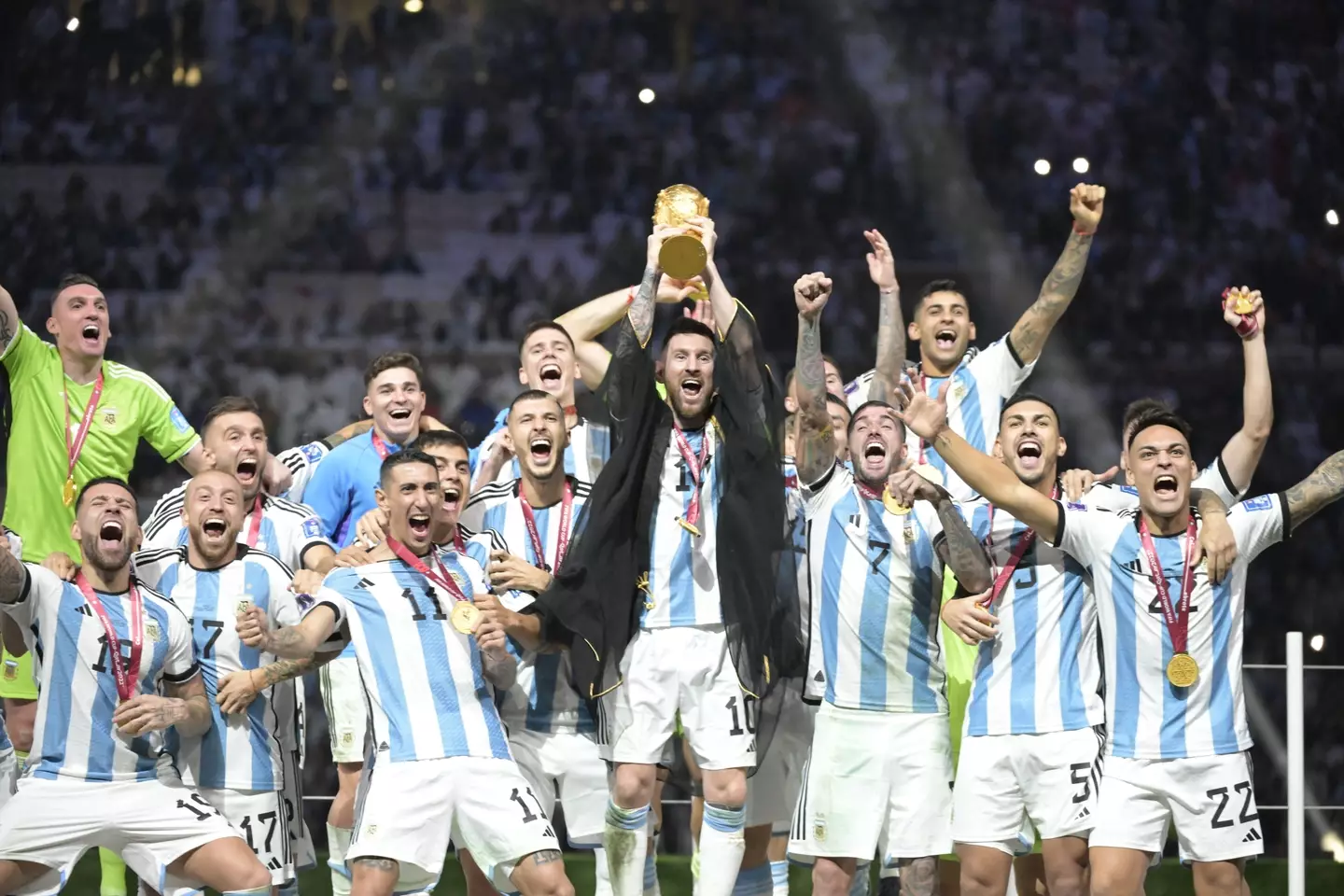 Lionel Messi lifting the FIFA World Cup.