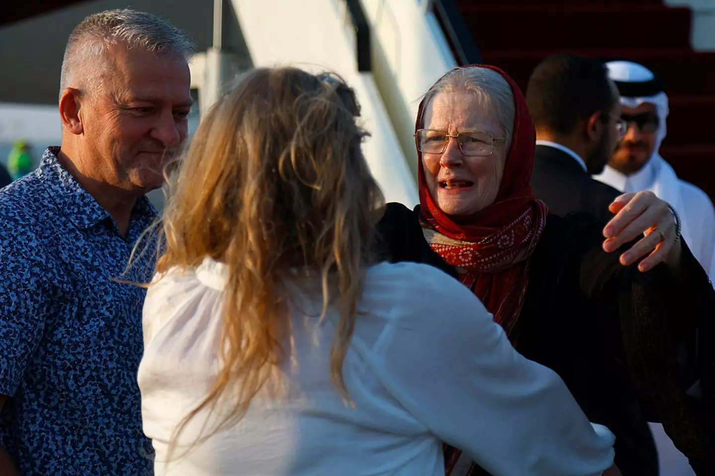 They were greeted by family at the airport (KARIM JAAFAR/AFP via Getty Images)