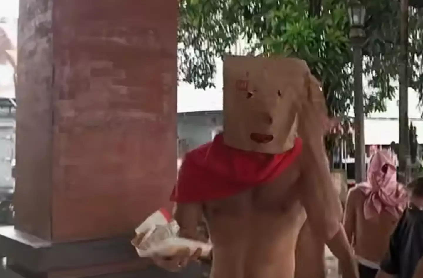 The men detained alongside Bonnie Blue concealed their faces (7 News)