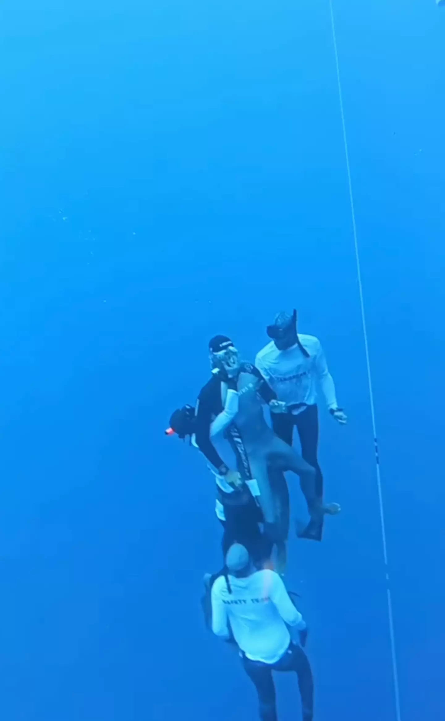 A blacked-out diver being rescued from a seriously dangerous situation.
