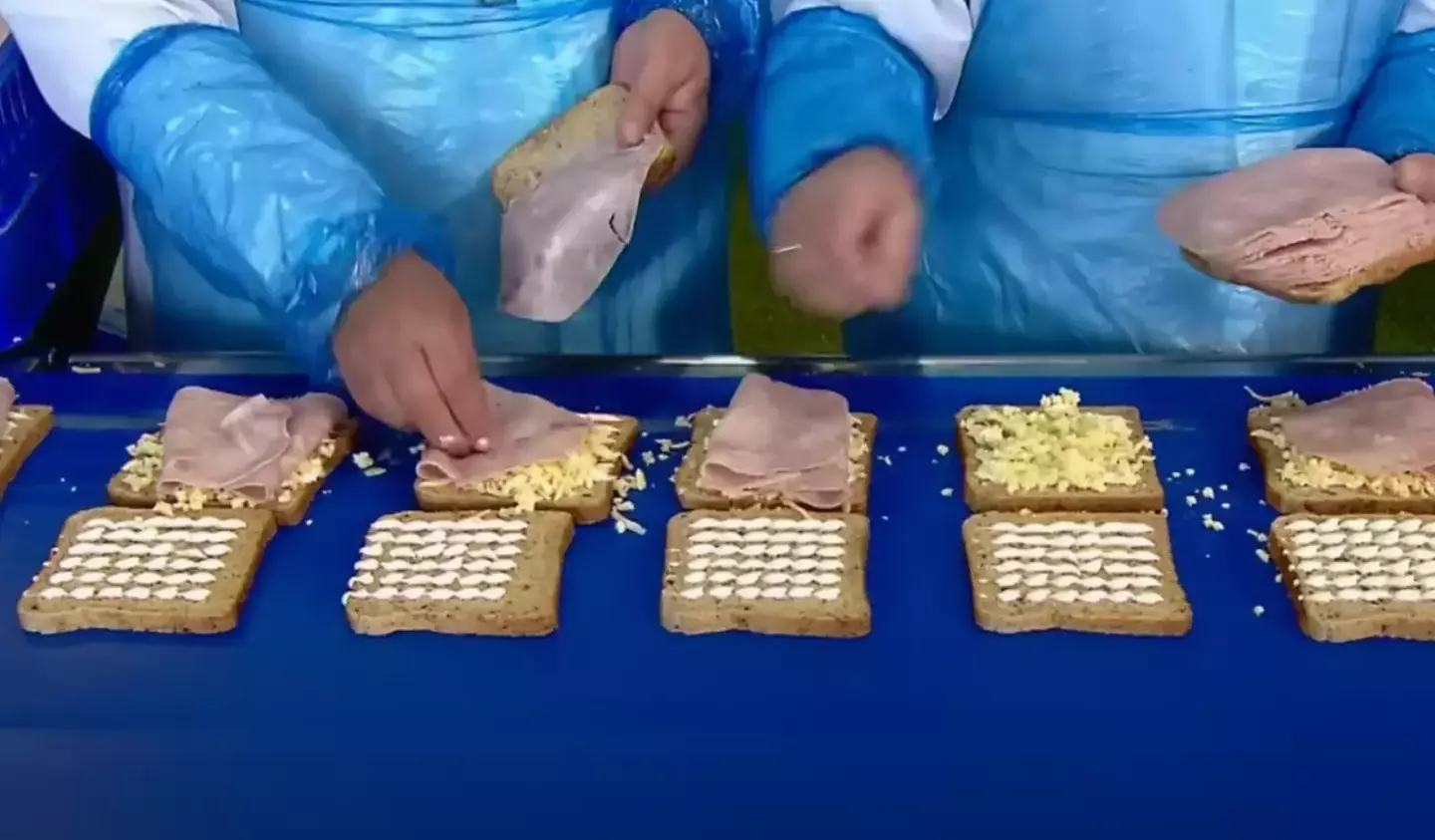 The documentary shows workers adding fillings to the sandwiches for one of the processes.
