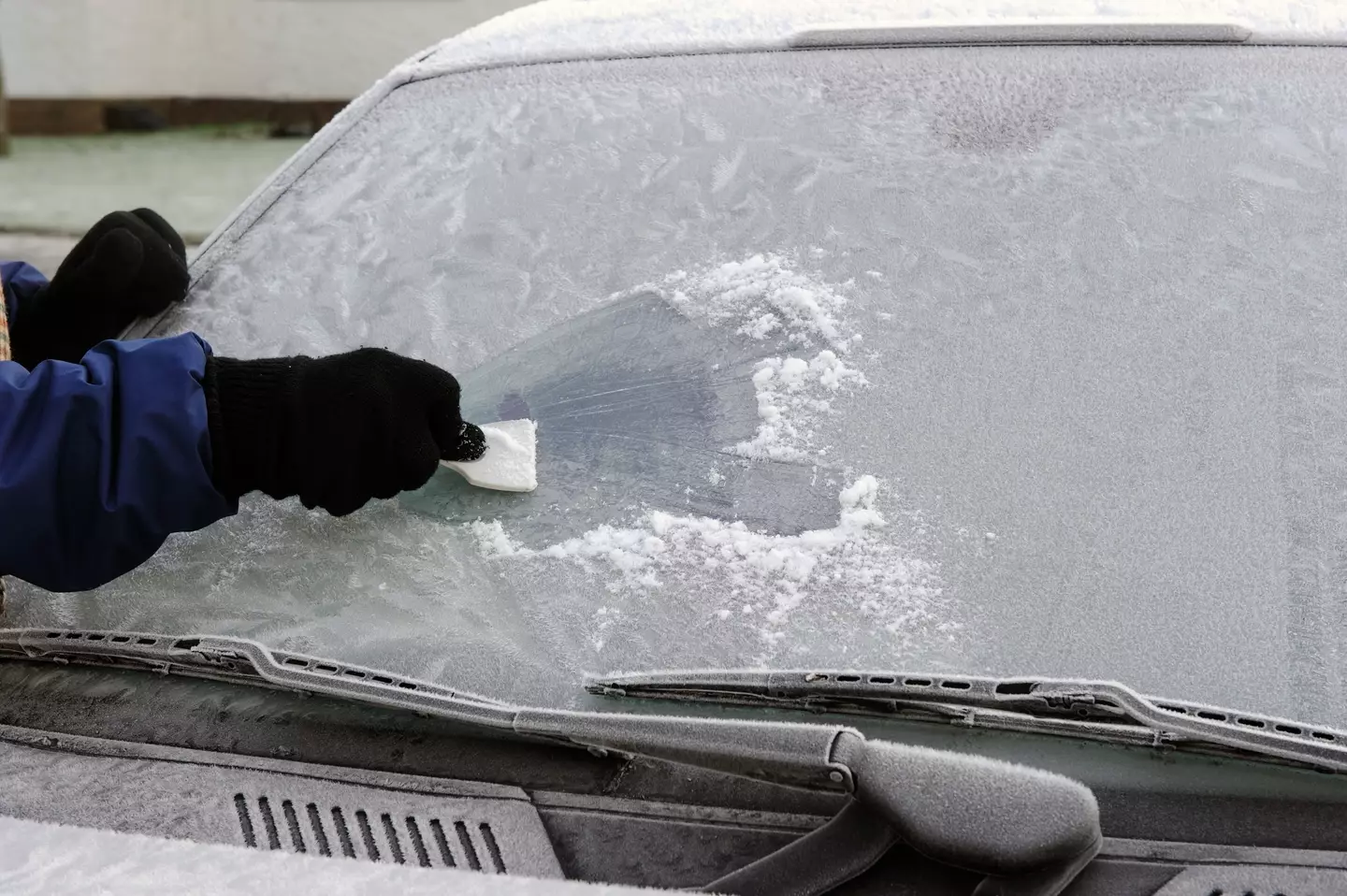 If you don't want to break out the scraper you could use your car's engine to clear the ice, but be careful.