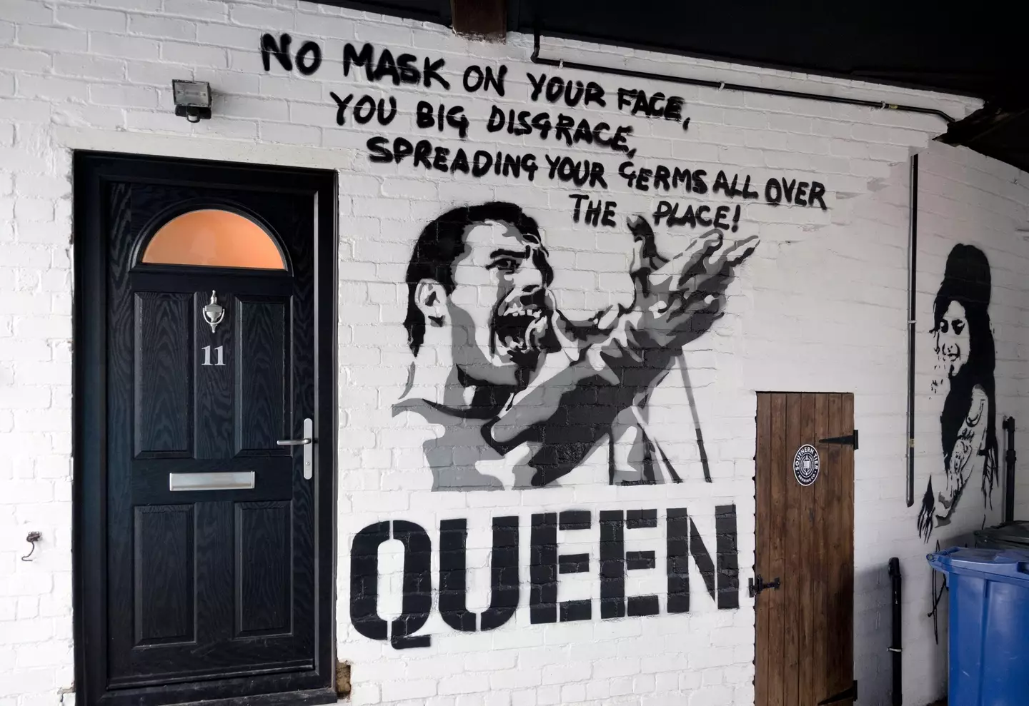 Covid-19 mask wearing Freddie Mercury / Queen graffiti art, Skipton, North Yorkshire, UK.