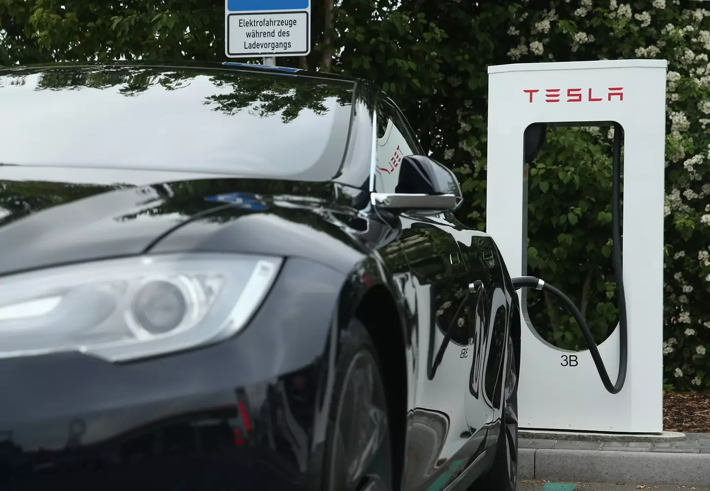 There are charging stations for electric cars, but most people will end up having to charge them at home (Sean Gallup/Getty Images)