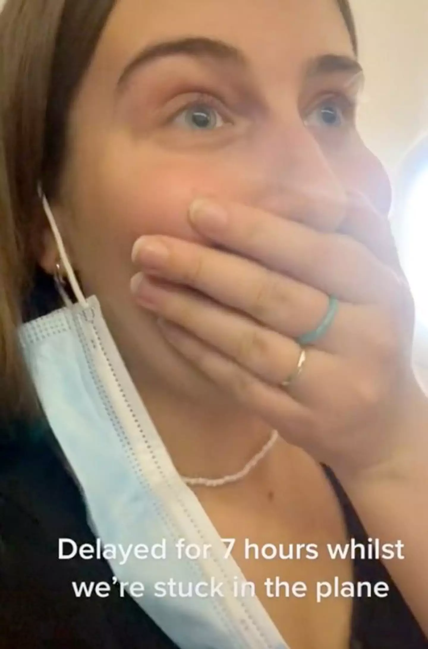A passenger looked gobsmacked as the pilot told them off.