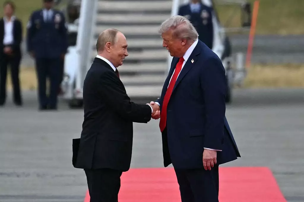 Donald Trump and Vladimir Putin were all smiles in front of the cameras (ANDREW CABALLERO-REYNOLDS/AFP via Getty Images)