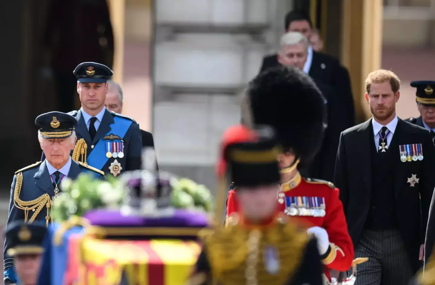 The two brothers marched through the procession side-by-side.