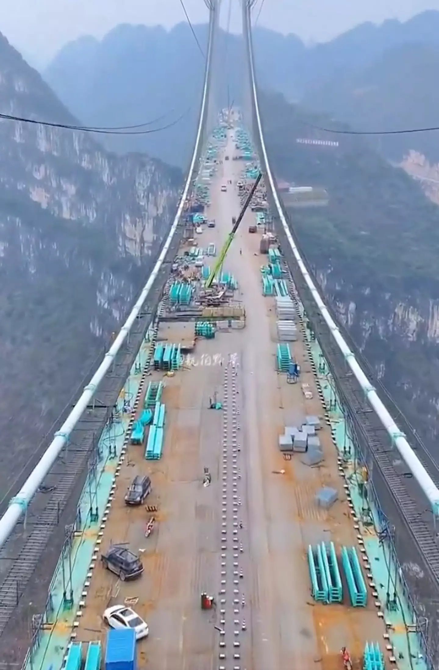 Crews were seen adding the finishing touches (X/collinrugg)