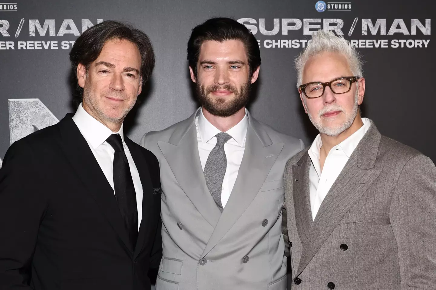 (L-R) Peter Safran, Co-CEO of DC Studios, David Corenswet, and James Gunn, Co-Ceo of DC Studios (Jamie McCarthy via Getty Images)