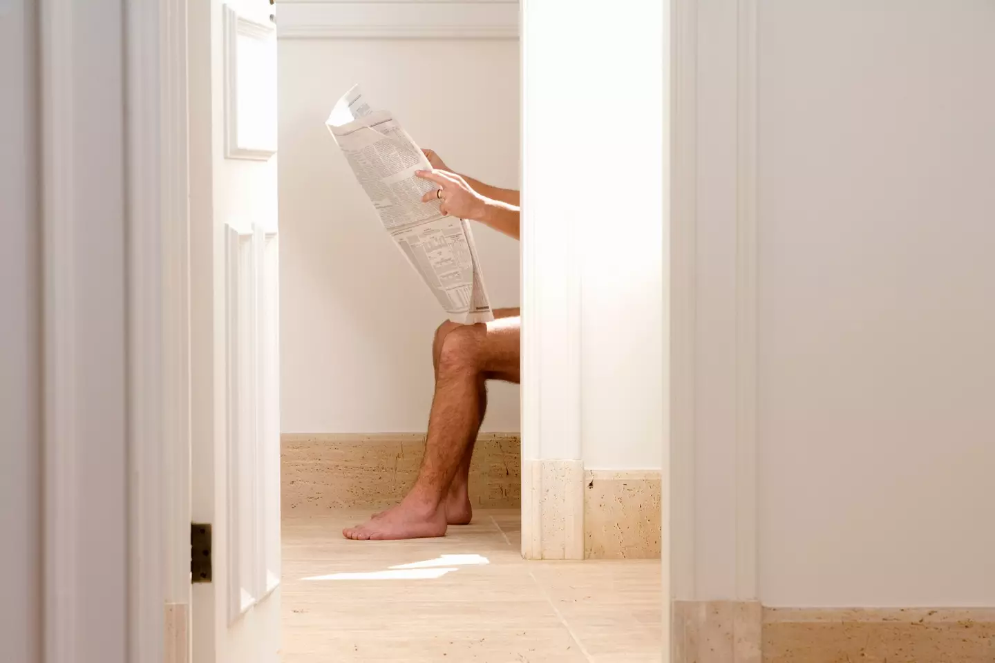 Unsurprisingly, on average, men spend more time on the loo than women. (Getty Stock Image)