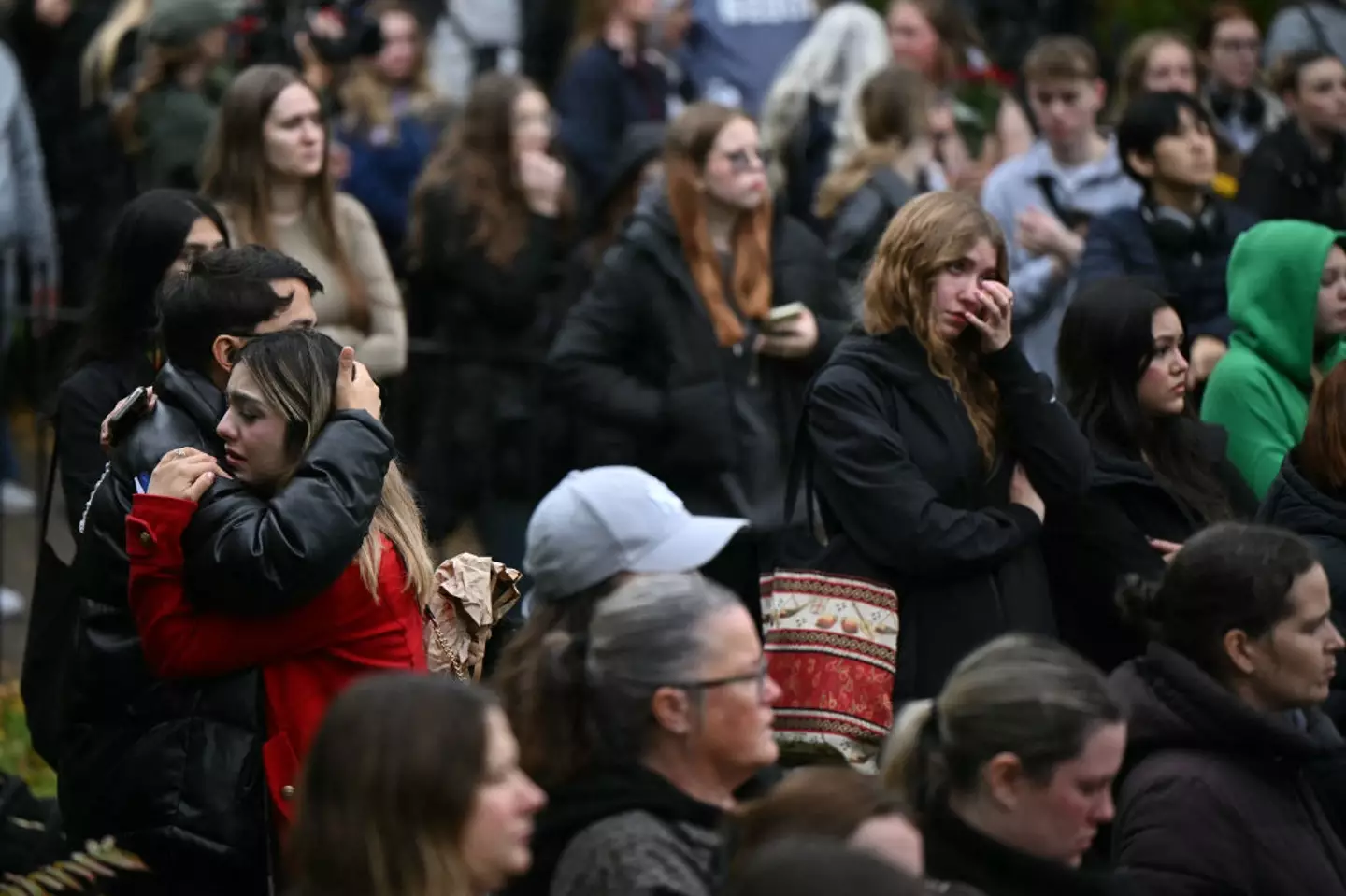 Grieving fans gathering around the Peter Pan statue in London's Hyde Park (JUSTIN TALLIS/AFP via Getty Images)