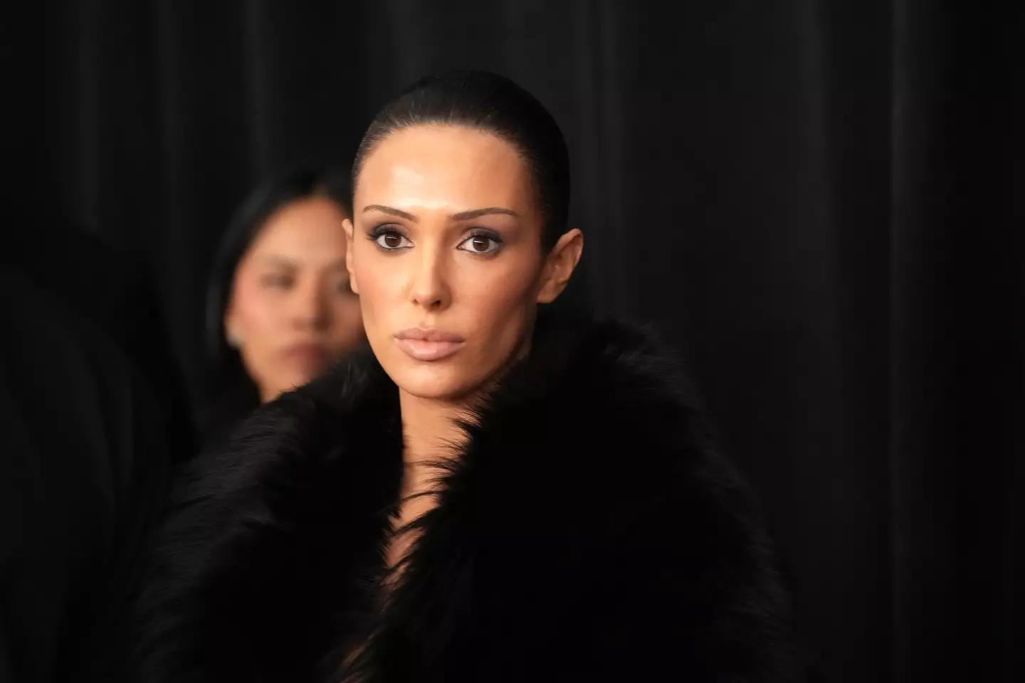 Censori wearing her fur coat before it was taken off for the viral moment (Jeff Kravitz/FilmMagic)