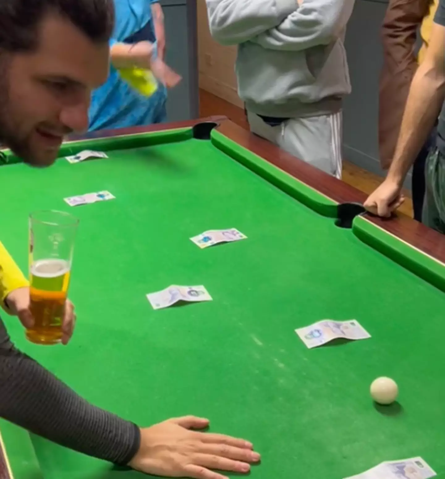 A bunch of lads have gone viral for inventing a new pub game which requires pretty much no skill and a bit of luck.