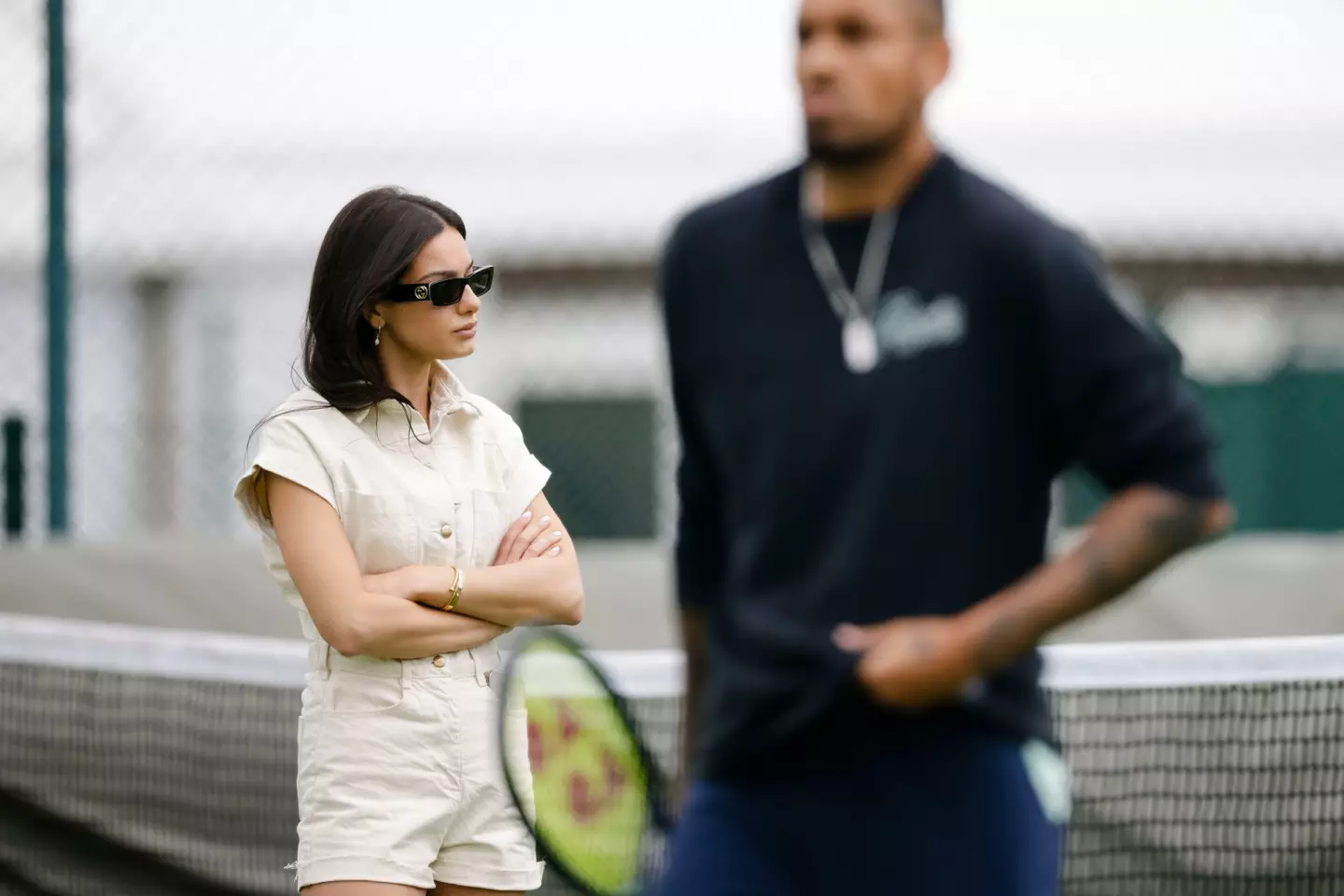 Costeen Hatzi, current girlfriend of Australian tennis pro Nick Kyrgios, stands on the practice court.