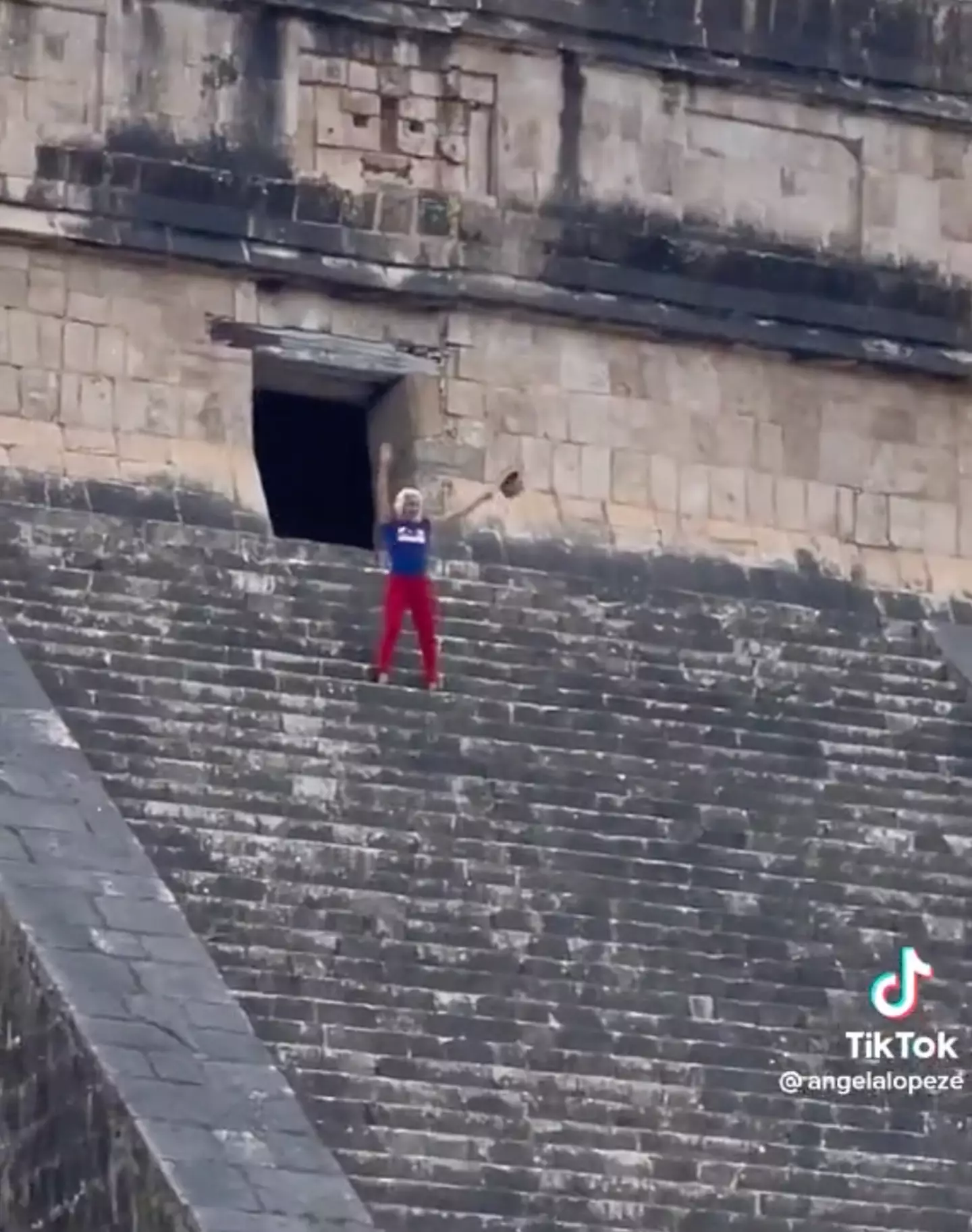 The tourist danced on the pyramid, despite being booed by the mob.