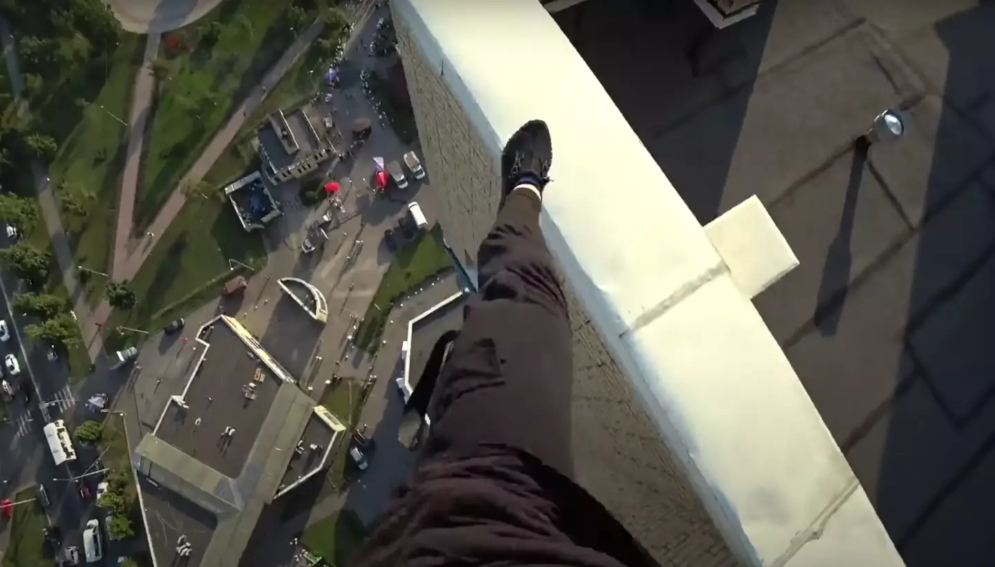 Bodycam footage captures the precise moment a parkour runner fell off the side of a high rise building.