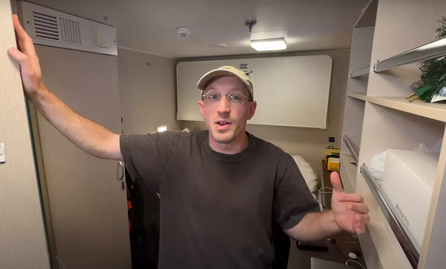 Bryan in his cabin (YouTube/BryanJamesCruises)