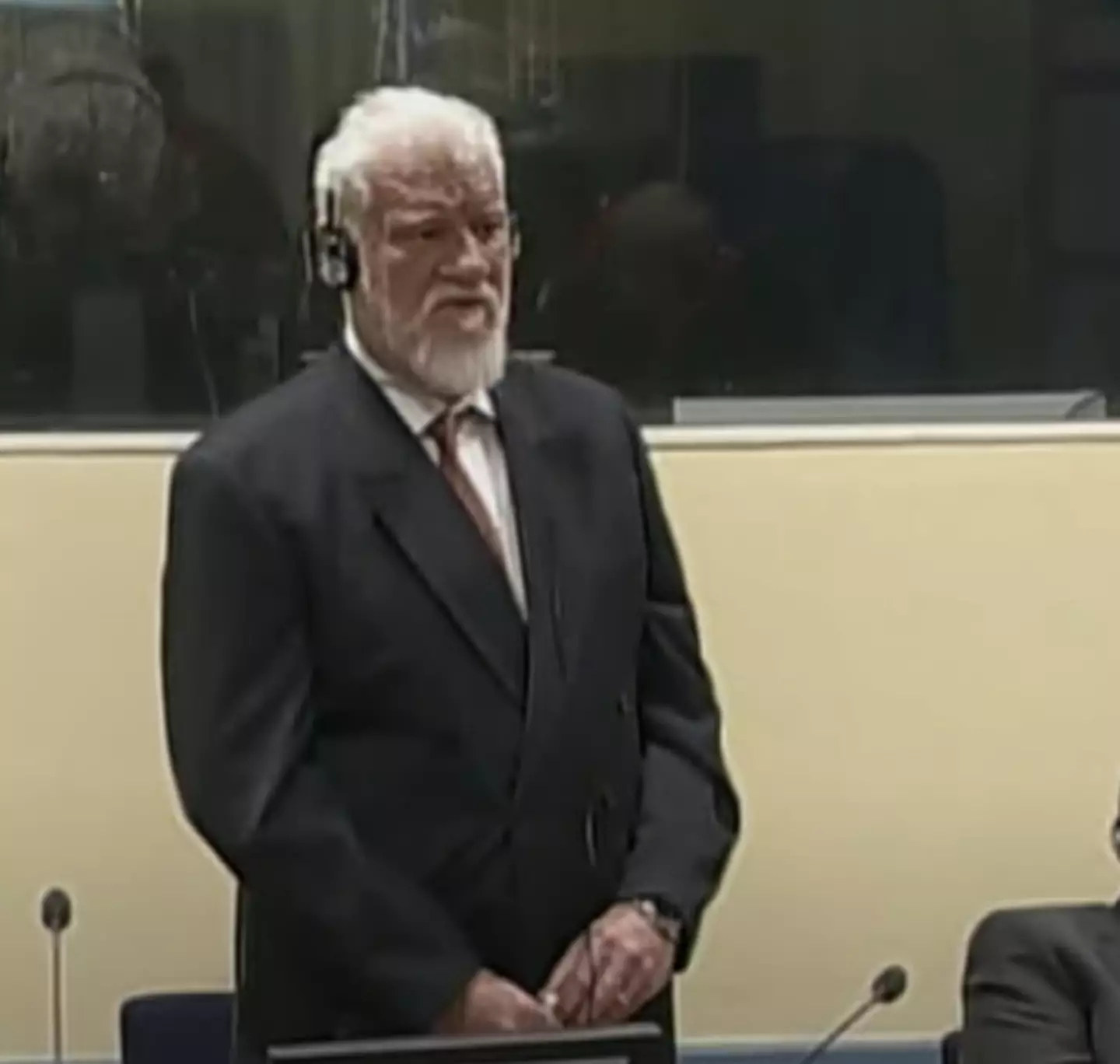 He was fiddling with the bottle in court (YouTube/TRTWorld)