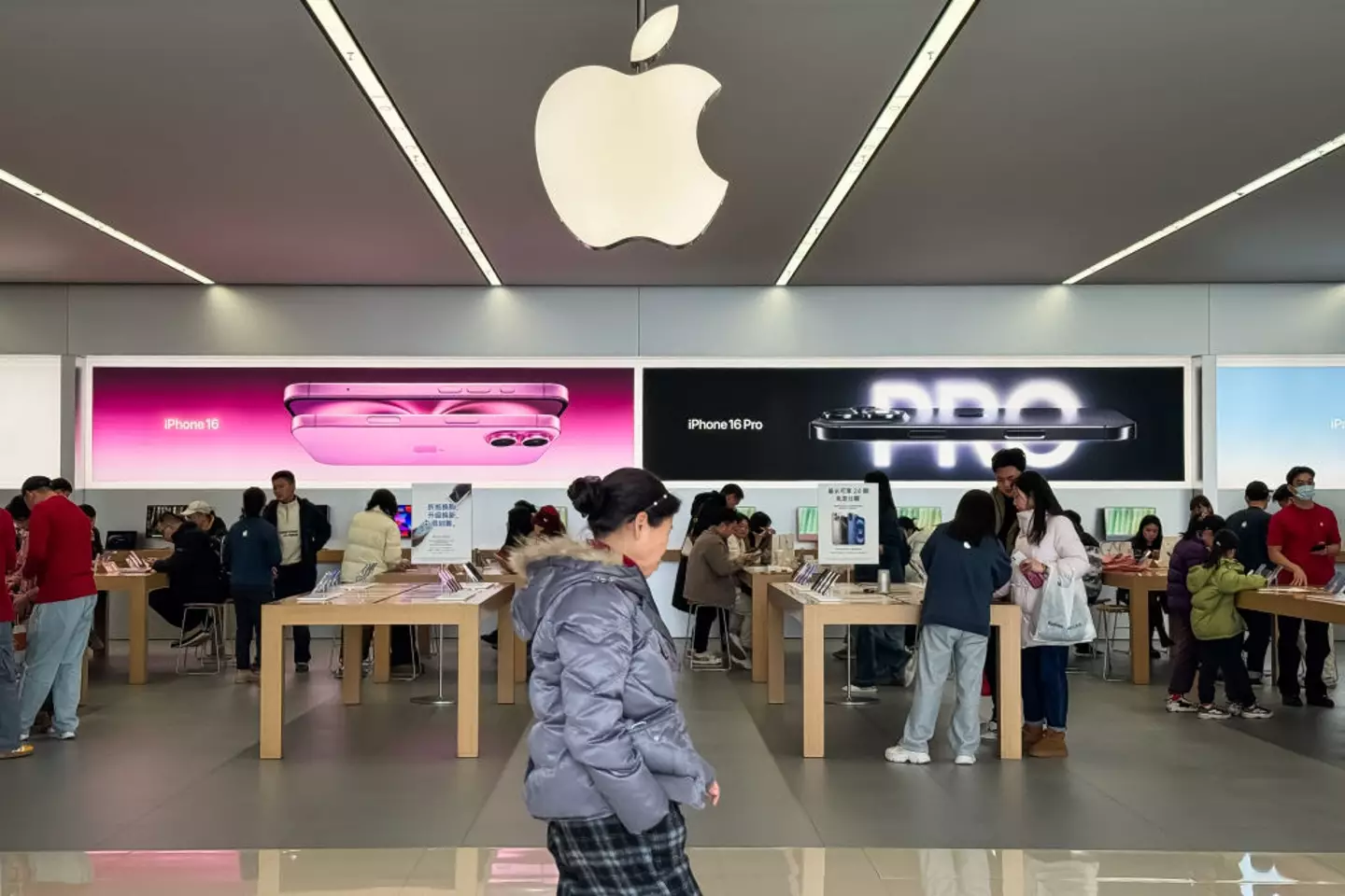 Updating your device to iOS 18.3.2 only takes a few steps (Cheng Xin/Getty Images)