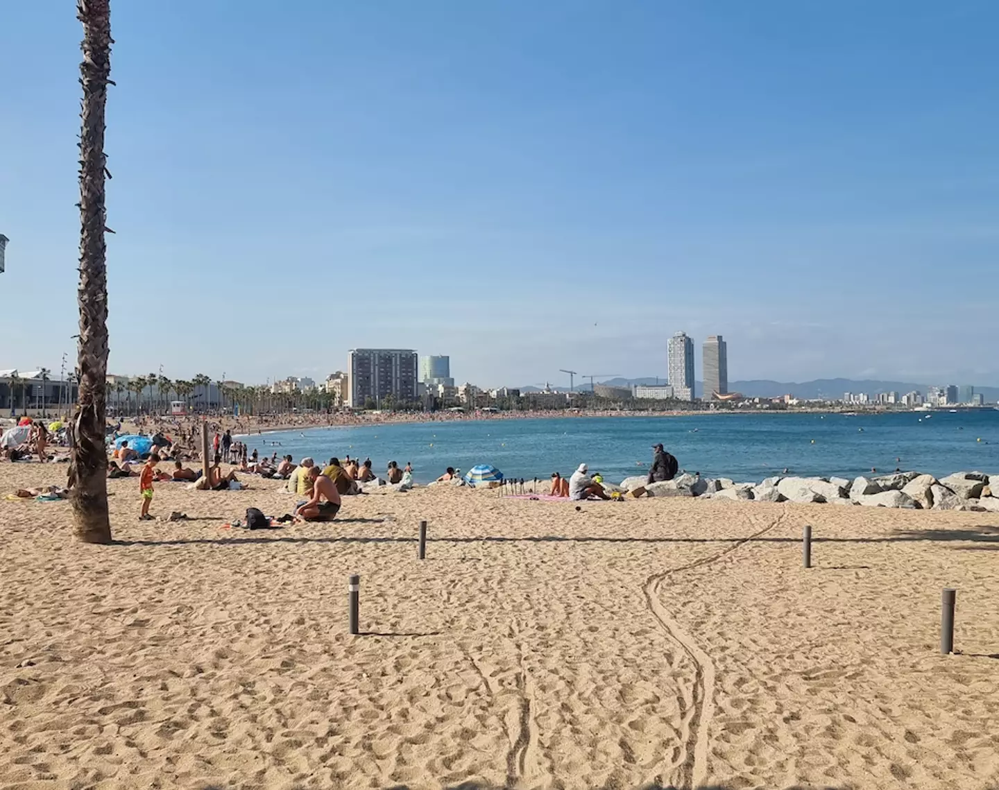 Tourists flock to the beach while abroad.