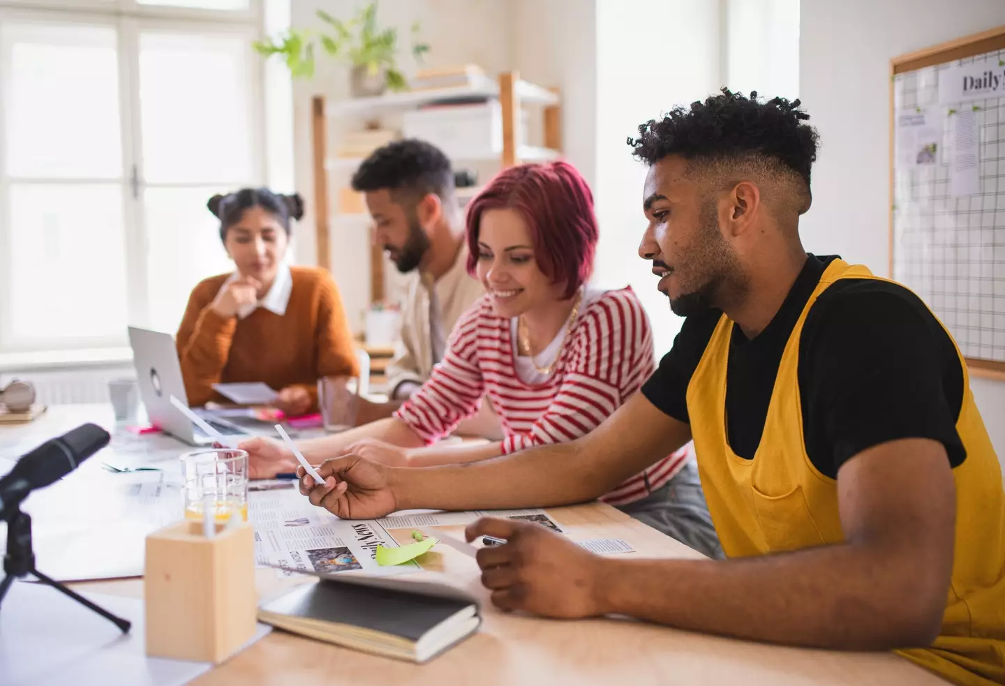 This is what you get when you search for pictures of Gen Z working. They all look so cloyingly happy. (Getty Stock Image)
