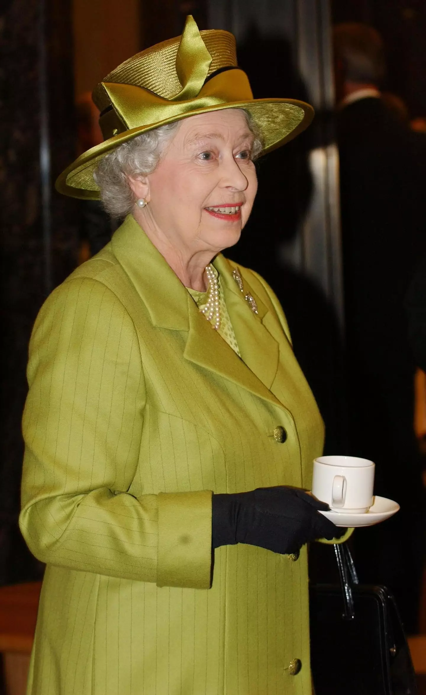 Queen Elizabeth with a cup of tea, credit: Alamy