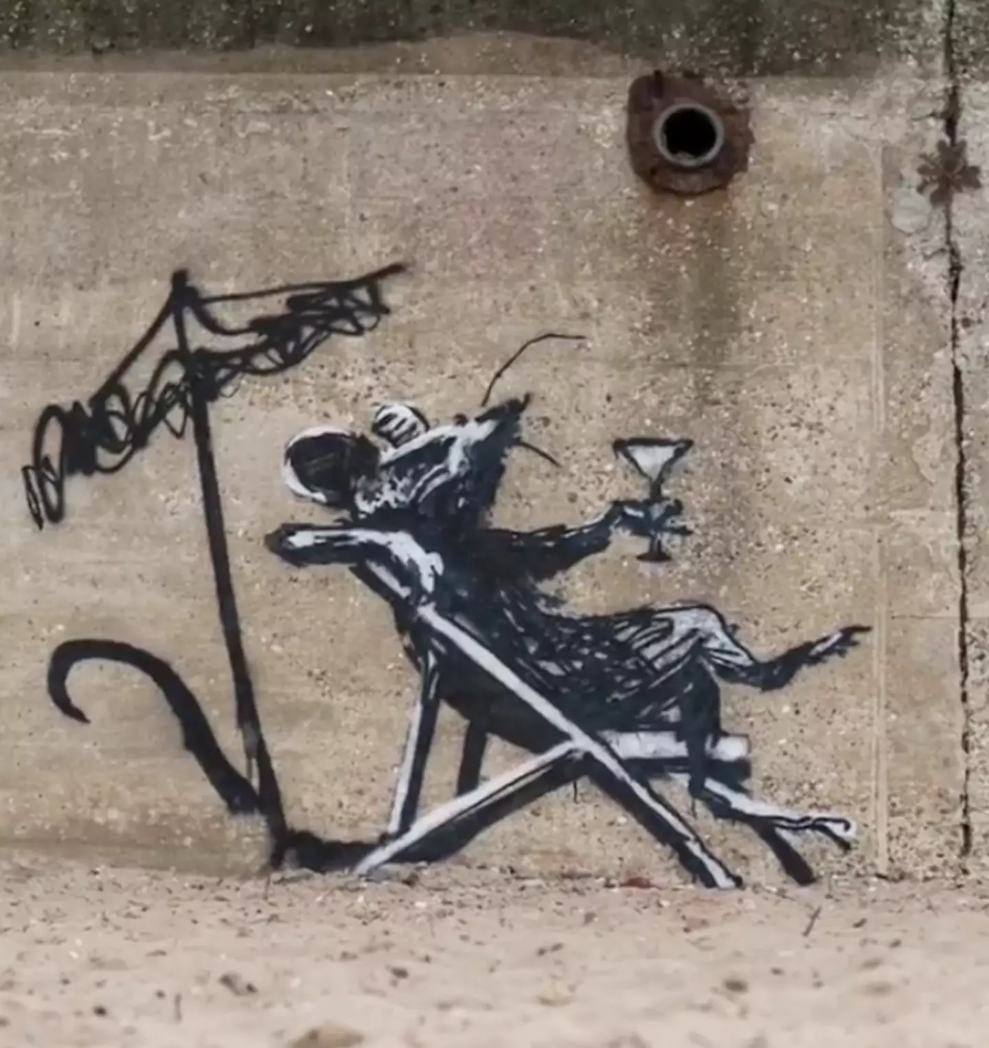 One of Banksy's pieces, which appeared at the bottom of Links Hill in North Beach, Lowestoft, depicts a rat reclining in a deckchair with a cocktail in its hand.