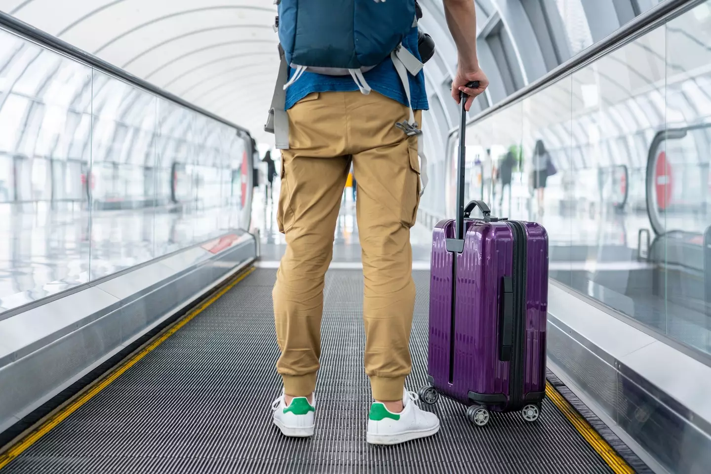 Man at an airport waiting to travel.