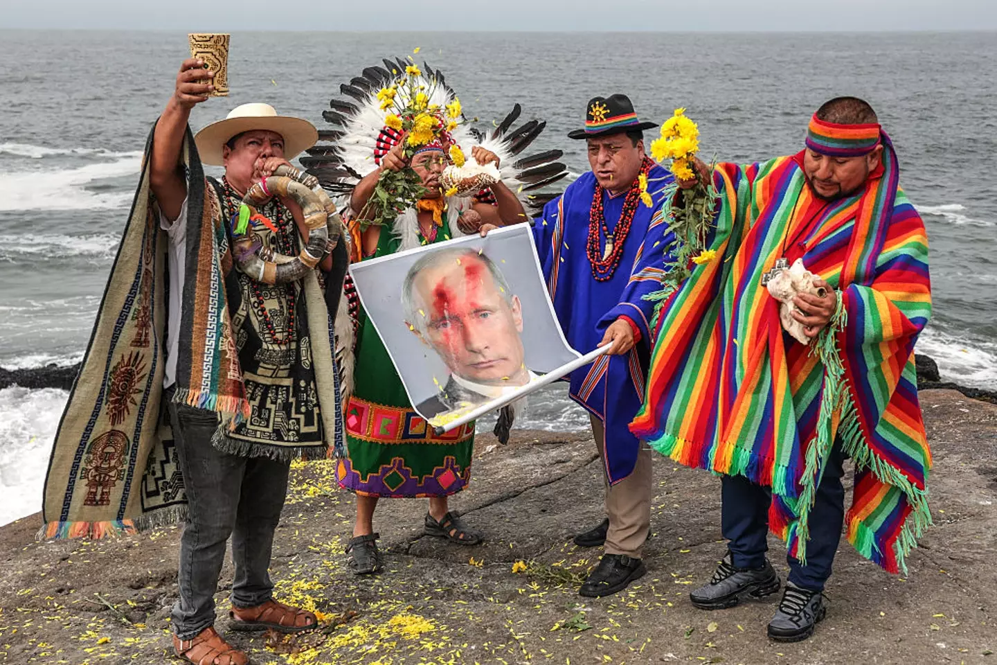 The ritual involved flowers, incense and posters of world leaders (Connie FRANCE / AFP via Getty Images)
