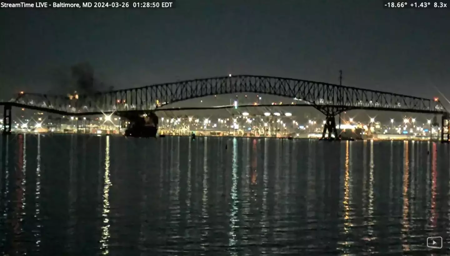 The bridge suddenly fell after the container ship collided with it.